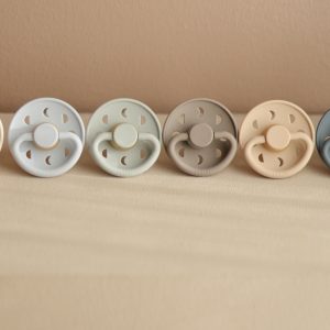 A FRIGG moon phase pacifier for baby