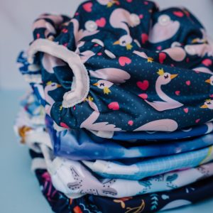 a pile of swim nappies in various prints